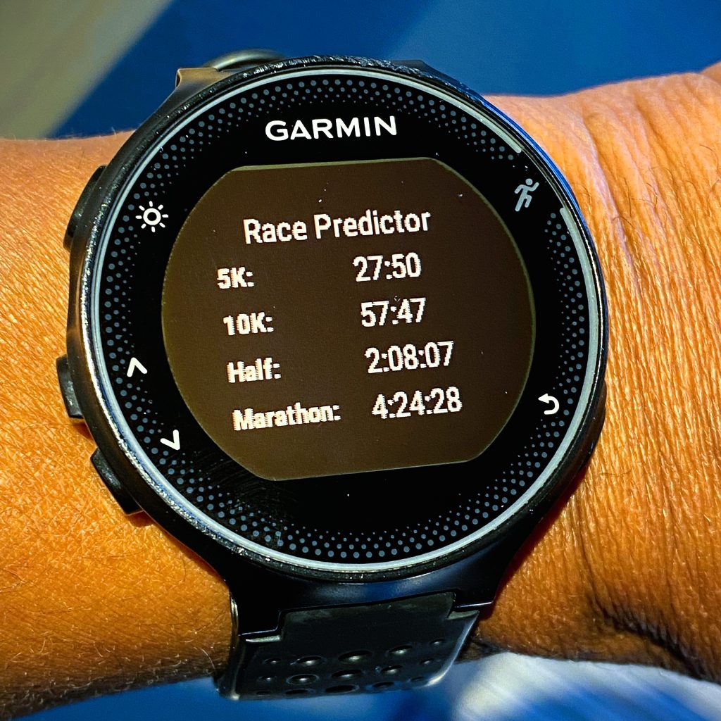 Garmin watch displaying post-race race predictor screen with marathon time of 4:24:28.